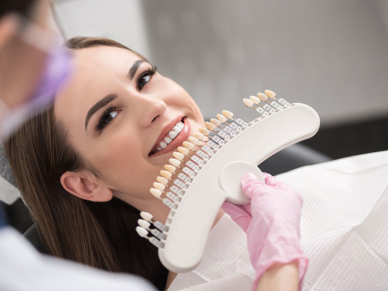 a woman getting dental crowns treatment