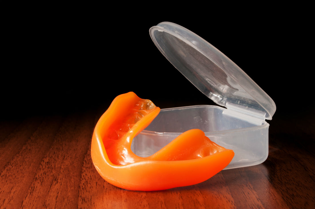 a plastic mouthpiece with a lid