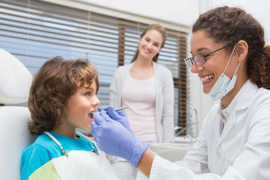 a person and a child at the dentist