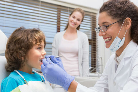 a person and a child at the dentist